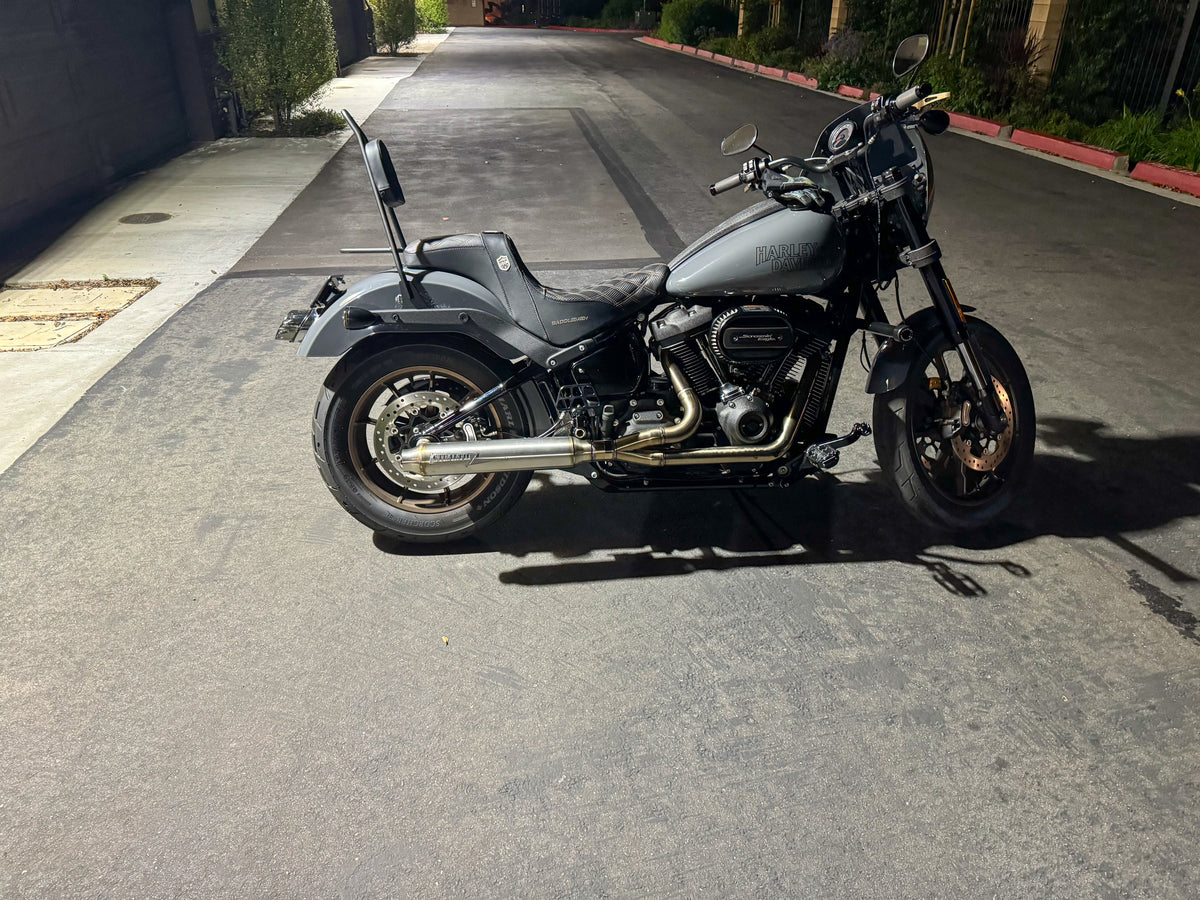 Stealth Pipes exhaust system installed on Harley M8 Softail – rear-side view of muffler and headers (2017–2025), photo 28 of 36