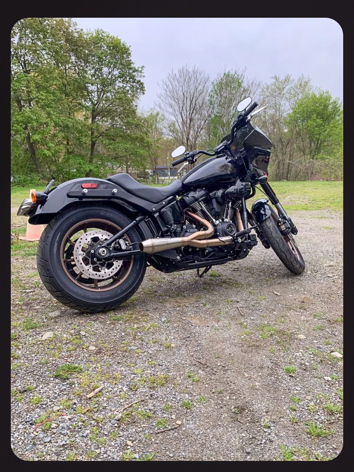Stealth Pipes exhaust system installed on Harley M8 Softail – rear-side view of muffler and headers (2017–2025), photo 19 of 36