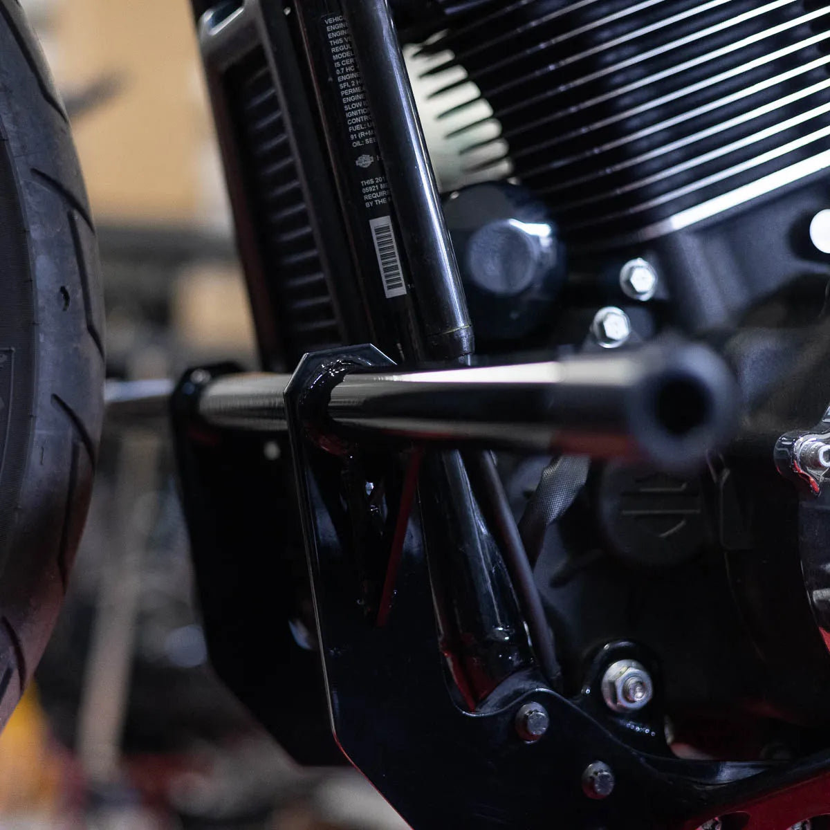 A black Softail Front Crash Bar designed for motorcycles, displayed installed on motorcycle., photo 3 of 10