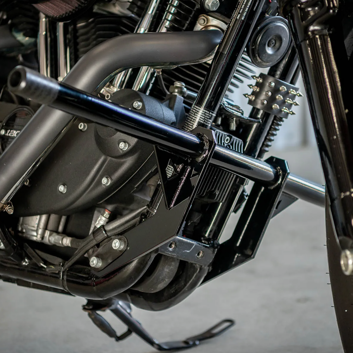 A black front crash bar installed on a Harley Davidson Sportster motorcycle, photo 5 of 6