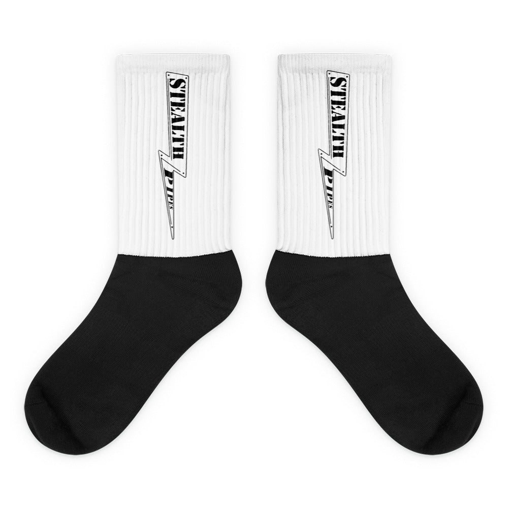 Pair of black and white Stealth Pipes crew socks with logo printed vertically on ribbed leg, photo 1 of 1